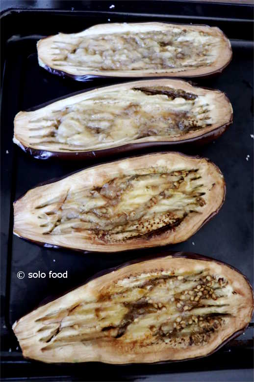 Eggplants Imam Bayildi -eggplants out of the oven with their body crashed with the fork