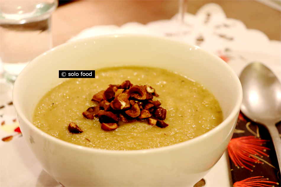 Soup with two celery, apple and hazelnuts