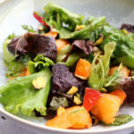 Green salad with melon, apricots and rosemary