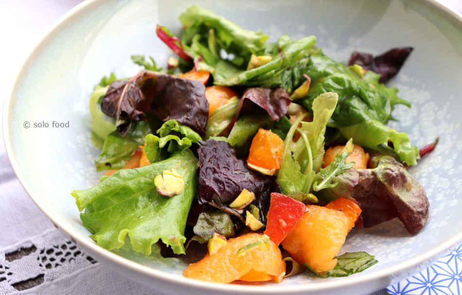 Green salad with melon, apricots and rosemary